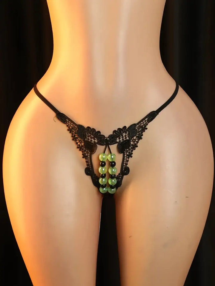 Plus-size sexy low-waist glow-in-the-dark pearl massage panties with open crotch, tempting sexy thong, sheer flirty g-string, passionate set for Valentine's Day, bold intimate apparel, revealing exotic enticing lingerie.